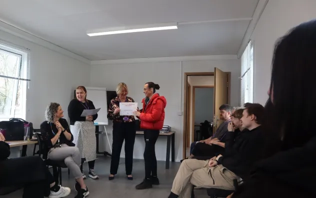 student receives certificate at young people