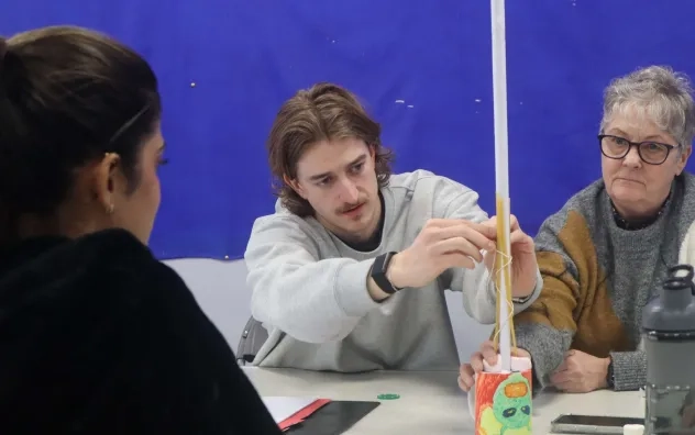Members of the LEAD programme photographed completing a spaghetti tower