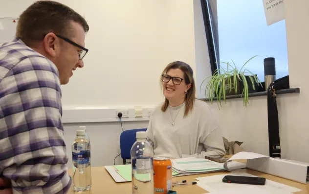LEAD Programme attendees smiling with each other while discussing group activities